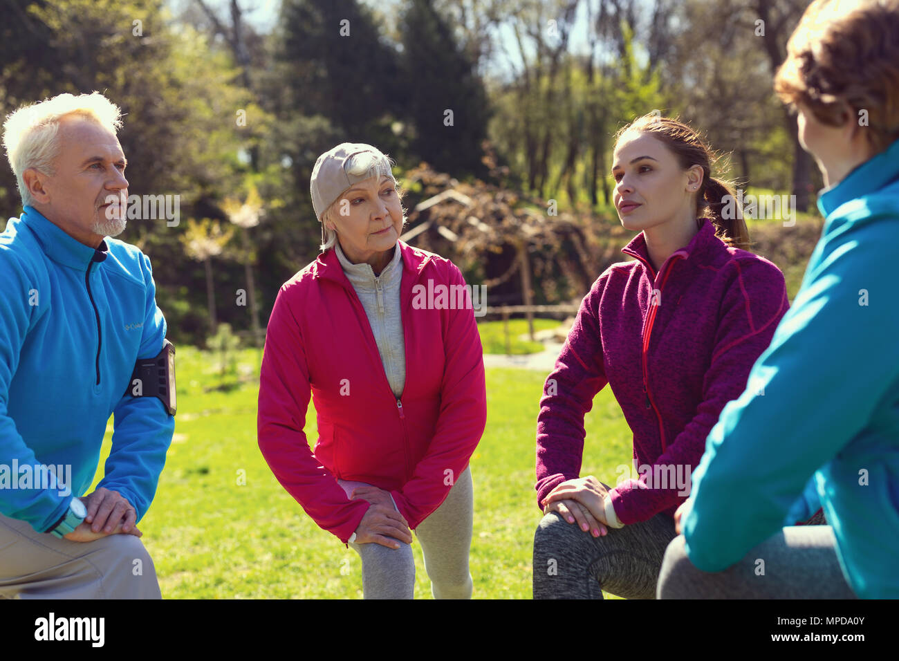 Determined people exercising in the park Stock Photo