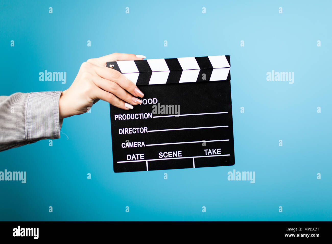Female hands holding a clapperboard Stock Photo