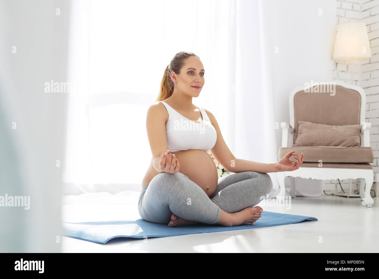 Calm pregnant woman discovering balance Stock Photo Alamy