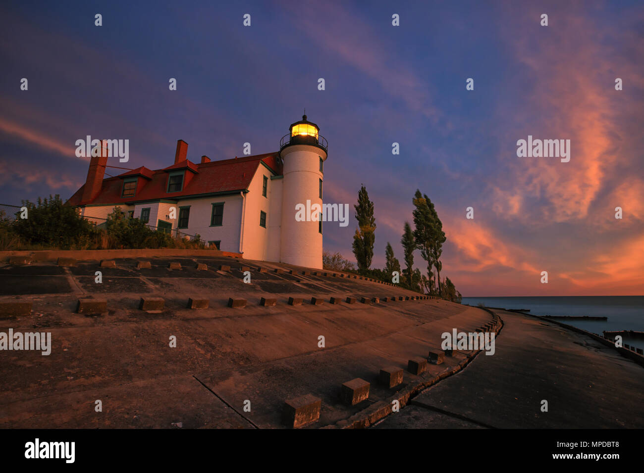 Sunset clouds over Lake Michigan and Point Betsie Lighthouse Stock Photo