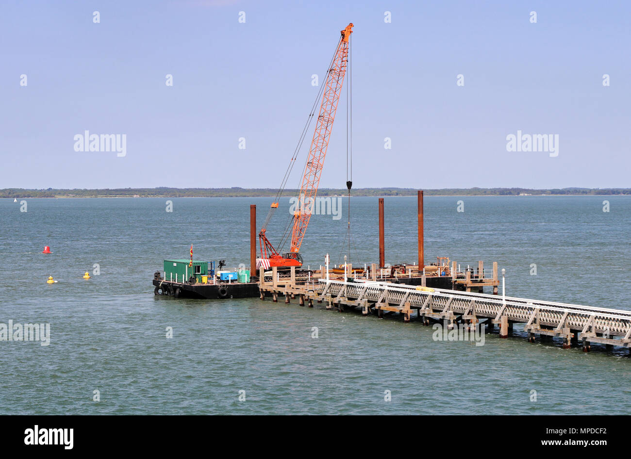 Crane on floating platform constructing a Jetty on the sea Stock Photo Alamy