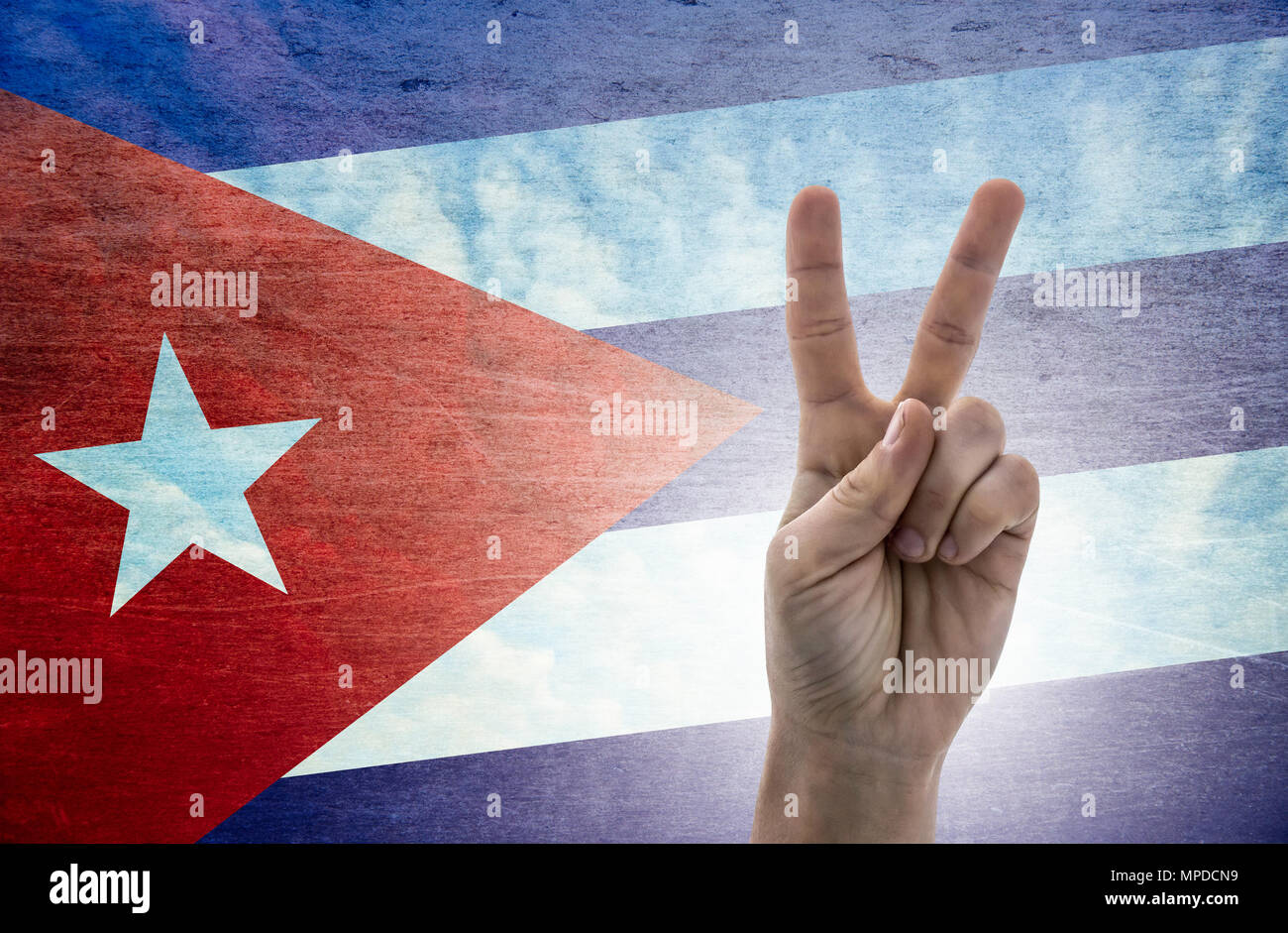 National symbol of victory: hand with two fingers with the flag of Cuba Stock Photo