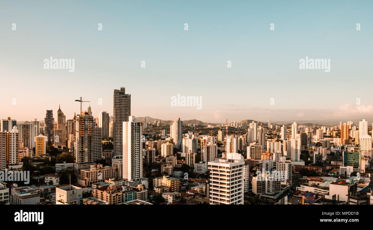 Aerial view above city skyline with many skyscraper buuldings - Panama City Stock Photo