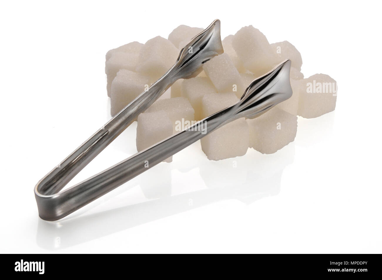 Sugar cubes and sugar tongs on white background Stock Photo Alamy