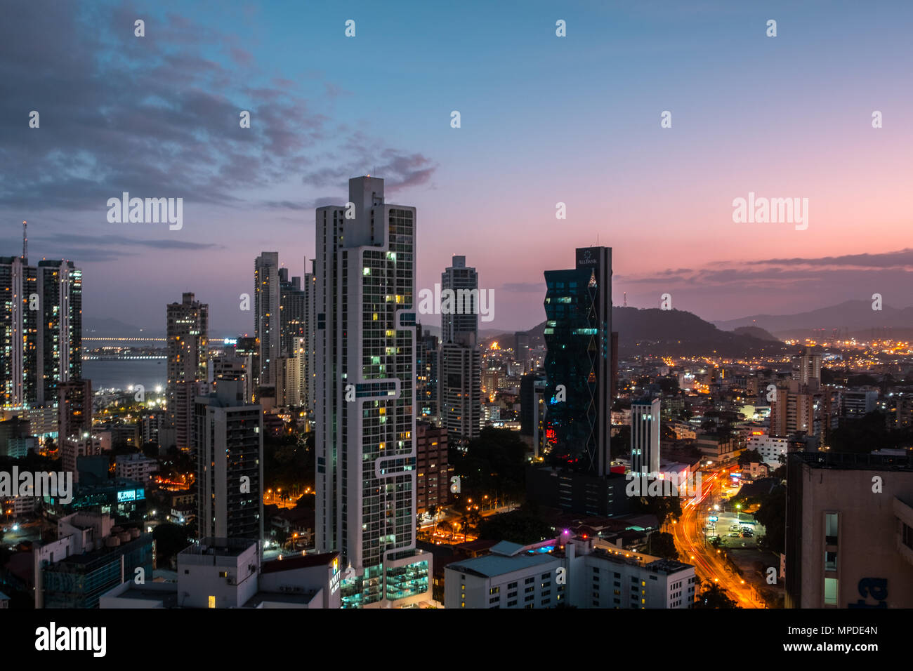 modern city skyline with sunset sky - skyscraper cityscape of Panama City Stock Photo