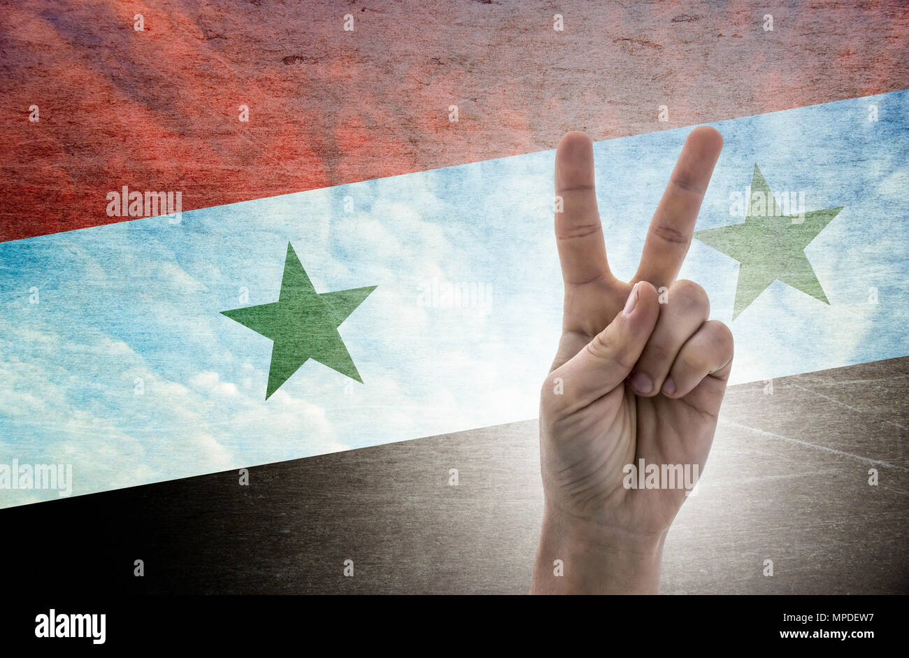 National symbol of victory: hand with two fingers with the flag of Syria Stock Photo