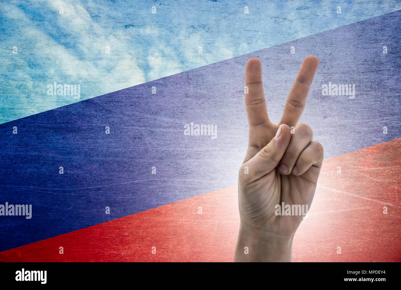 National symbol of victory: hand with two fingers with the flag of Russia Stock Photo