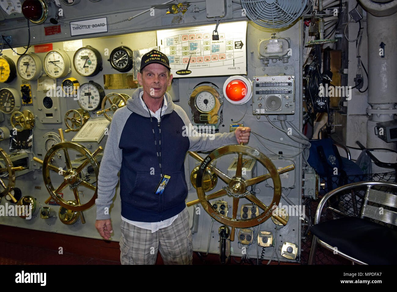 US Navy Vietnam Veteran hand on the throttle in the engine room ...