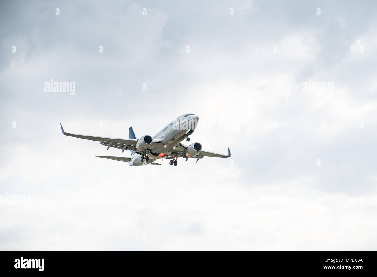Commercial airplane on sky - passenger aircraft isolated Stock Photo