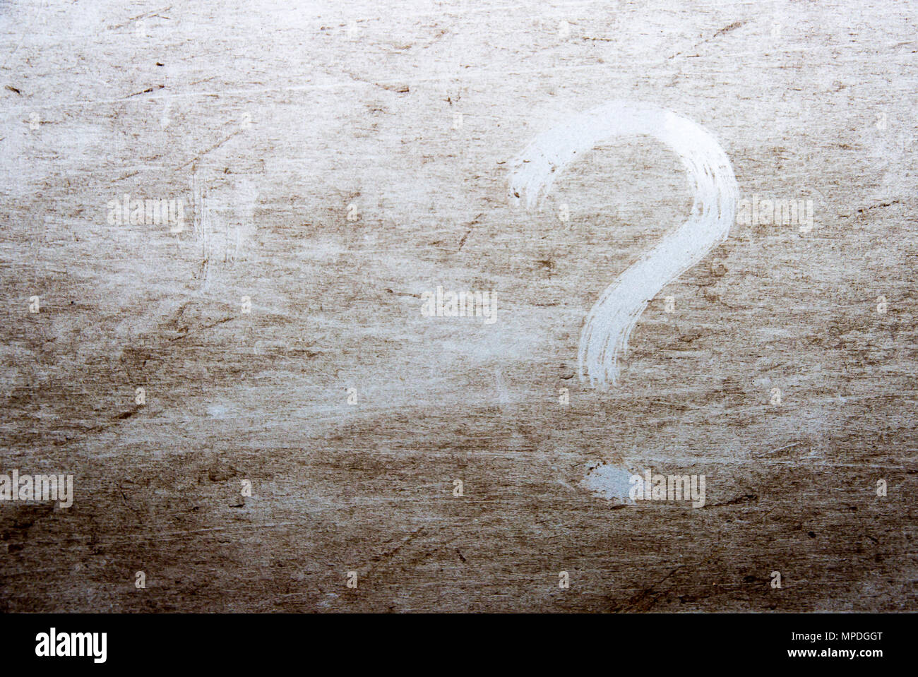 question mark is drawn on scratched dirty background Stock Photo