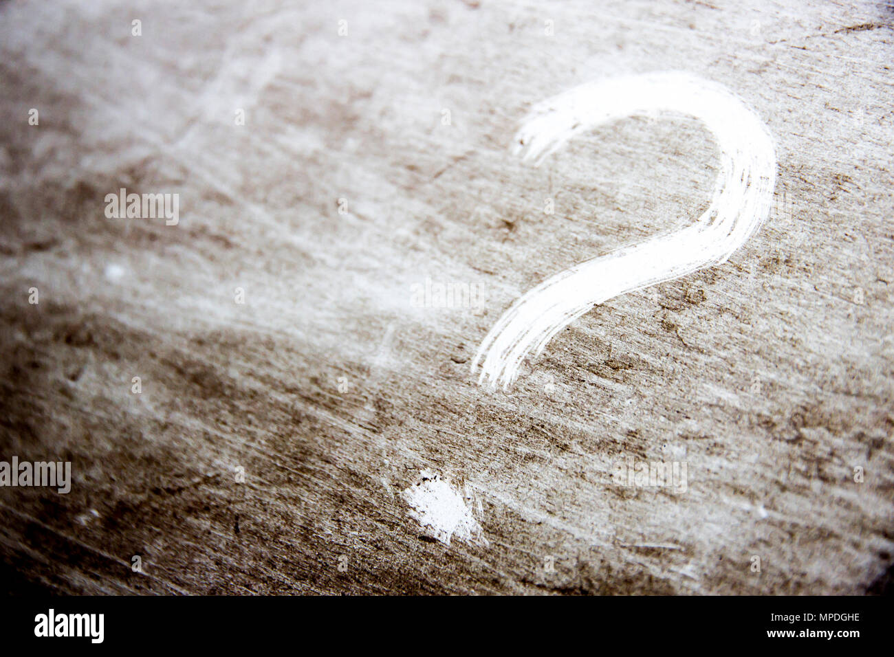 question mark is drawn on scratched dirty background Stock Photo