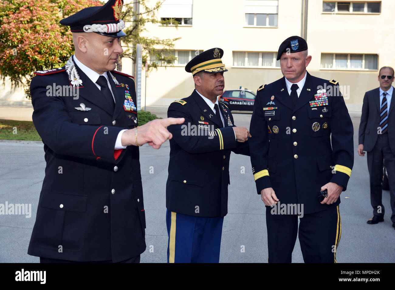 U.S. Army Col. Darius S. Gallegos (center), Center of Excellence for Stability Police Units (CoESPU) deputy director, Lt. Gen Vincenzo Coppola (left), deputy commander of the Carabinieri Corps, welcome Maj. Gen. Joseph P. Harrington, U.S. Army Africa Commanding General, during the visit NATO JFC-Naples Commander, Admiral Michelle Howard at the CoESPU Vicenza, April 10, 2017. Stock Photo