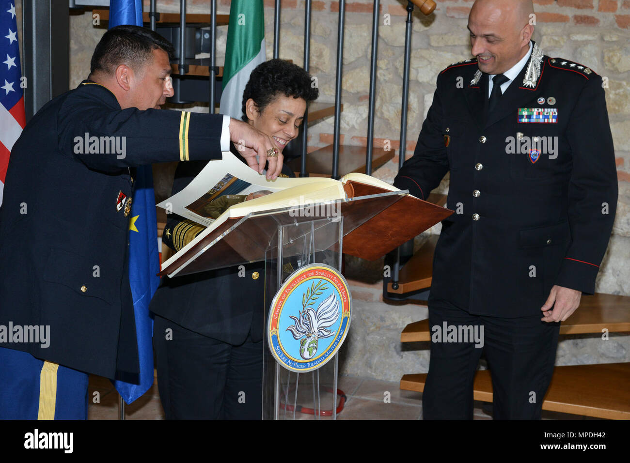 Admiral Michelle Howard, NATO JFC-Naples Commander, shows signs the guest of honor book during the visit at the Center of Excellence for Stability Police Units (CoESPU) Vicenza, April 10, 2017. Stock Photo
