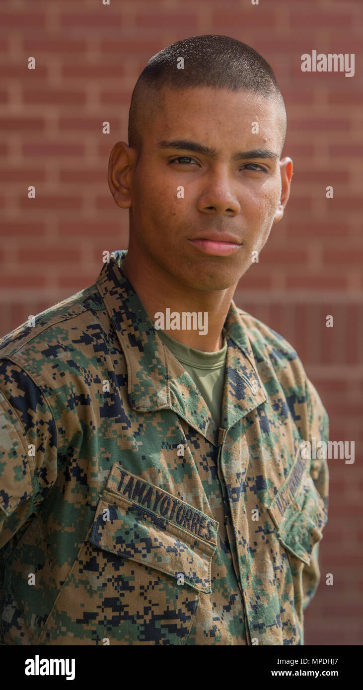 Pvt. Juan C. Tamayo Torres, Platoon 1014, Delta Company, 1st Recruit Training Battalion, earned U.S. citizenship March 2, 2017, on Parris Island, S.C. Before earning citizenship, applicants must demonstrate knowledge of the English language and American government, show good moral character and take the Oath of Allegiance to the U.S. Constitution. Tamayo Torres, from Queens, N.Y., originally from Colombia, is scheduled to graduate March 3, 2017. (Photo by Lance Cpl. Maximiliano Bavastro) Stock Photo