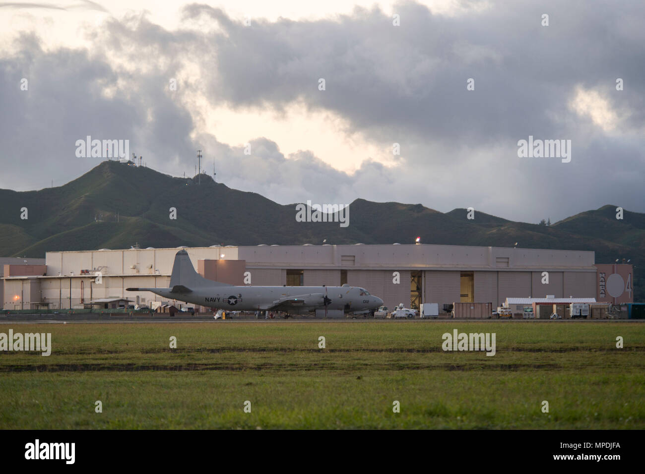170303-N-YW024-006 KANEOHE BAY, HAWAII (Mar. 3, 2017) A P-3 Orion, assigned to Patrol Squadron Nine (VP-9) Golden Eagles, takes off during a command disestablishment at Marine Corps Base Hawaii. The VP-9  squadron was leaving for a scheduled deployment, to be followed by a homeport shift to Naval Air Station Whidbey Island in Washington. The P-3 Orion is a four-engine turboprop anti-submarine and maritime surveillance aircraft developed by the U.S. Navy in the 1960s. (U.S. Navy photo by Mass Communication Specialist 2nd Class Katarzyna Kobiljak) Stock Photo