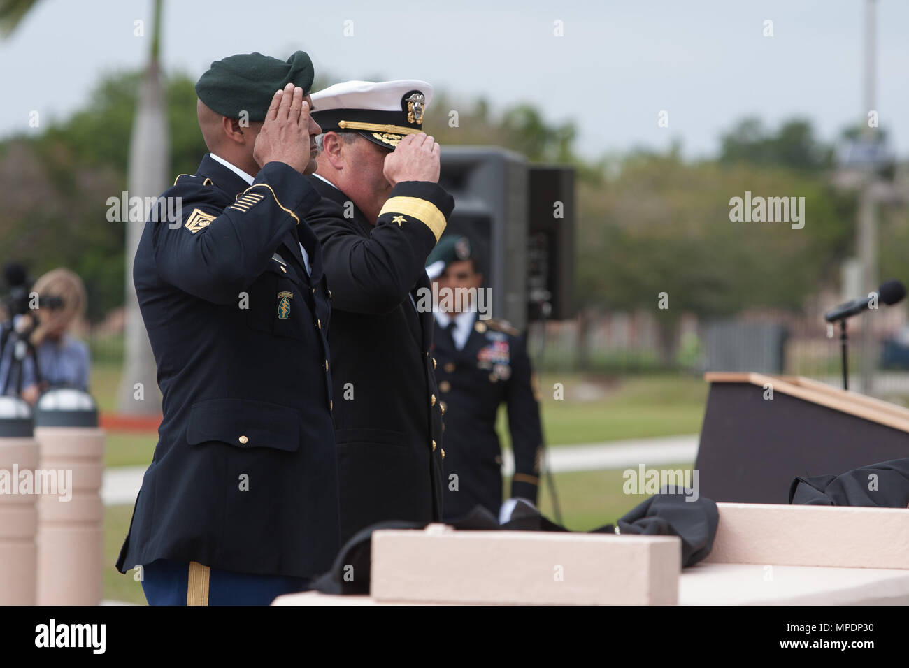 Special Operations Command South leaders salute a memorial dedicated to ...