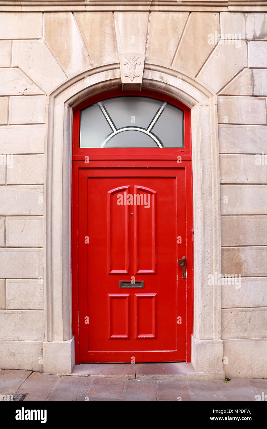 Blitz software Bekostning Stone facade with red door of an English style house located in Gibraltar  Stock Photo - Alamy