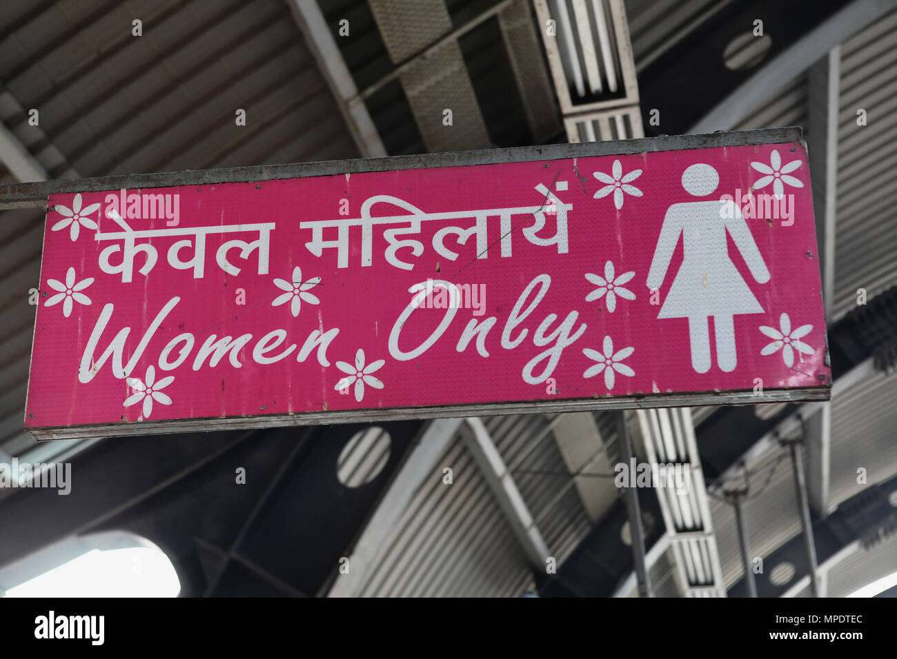 India, New Delhi, Sign for the women only section of the metro train at Ramakrishna Ashram Marg metro station. Stock Photo