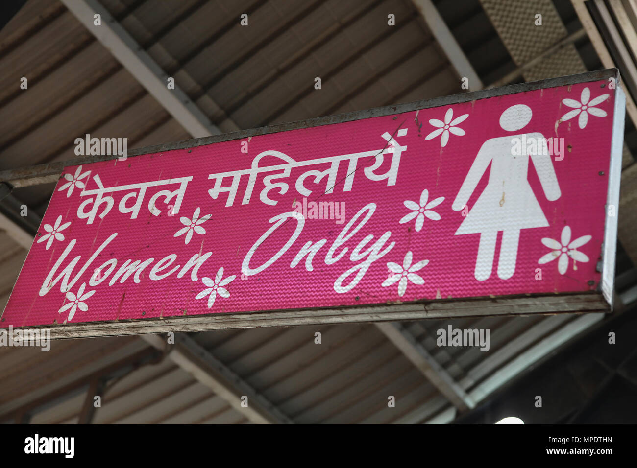 India, New Delhi, Sign for the women only section oif the metro train at Ramakrishna Ashram Marg metro station. Stock Photo