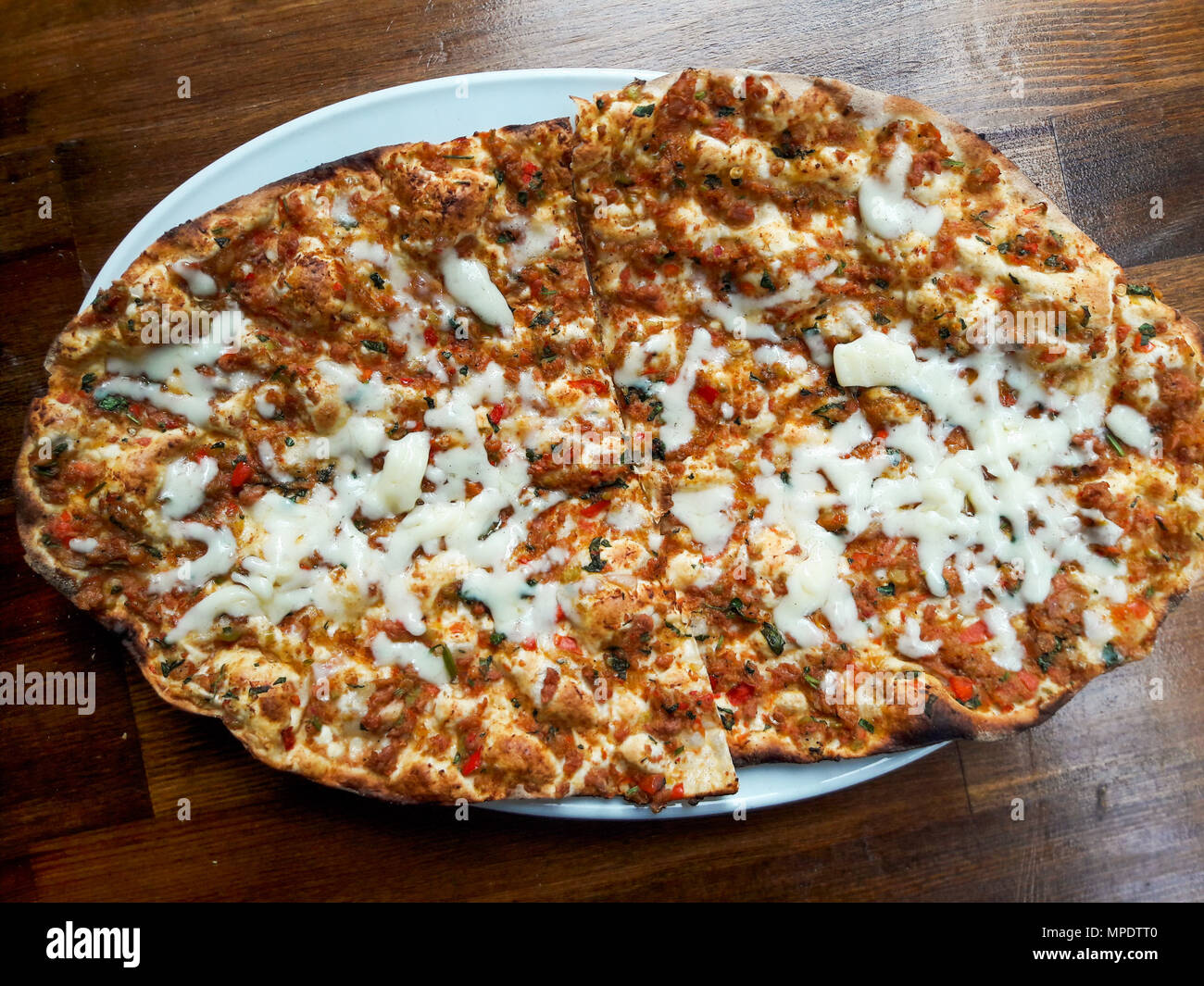 Turkish Pizza Lahmacun with Melted Cheese / Kasar Peyniri. Traditional Food. Stock Photo