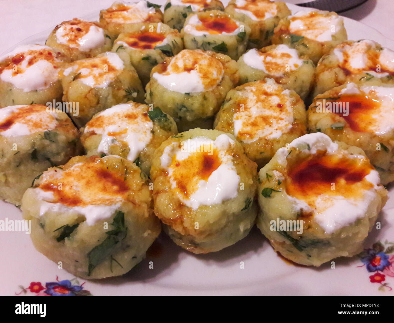 Turkish Potato Dumplings (Manti) with Yogurt and Sauce / Patates Mantisi. Traditional Food. Stock Photo