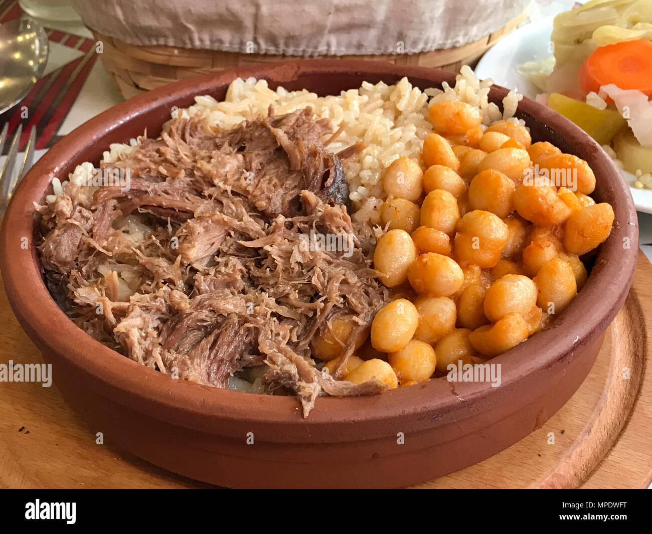 Turkish Pilav or Pilaf Rice with Baked Beans (Kuru fasulye) and Kavurma (Braised Meat). Street