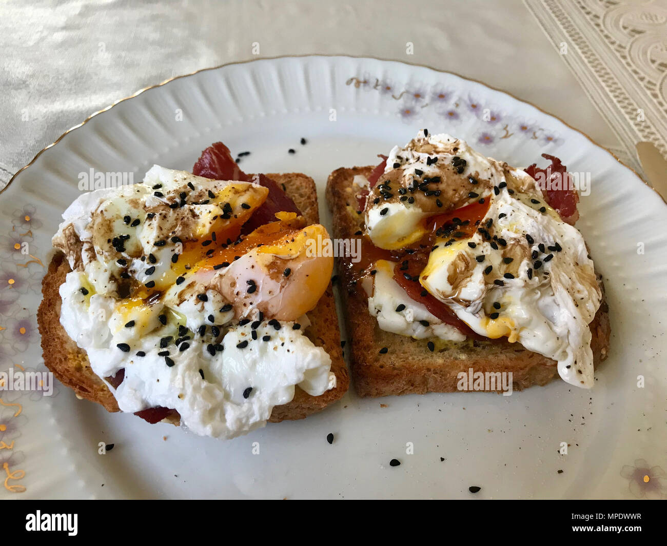 Poached Egg on Toast Bread with Cheddar Cheese, Balsamic Vinegar, Salad and Black Sesame or