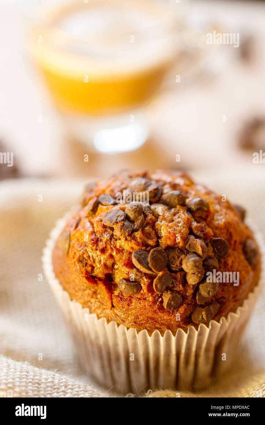 Chocolate a muffin near the coffee latte Stock Photo - Alamy