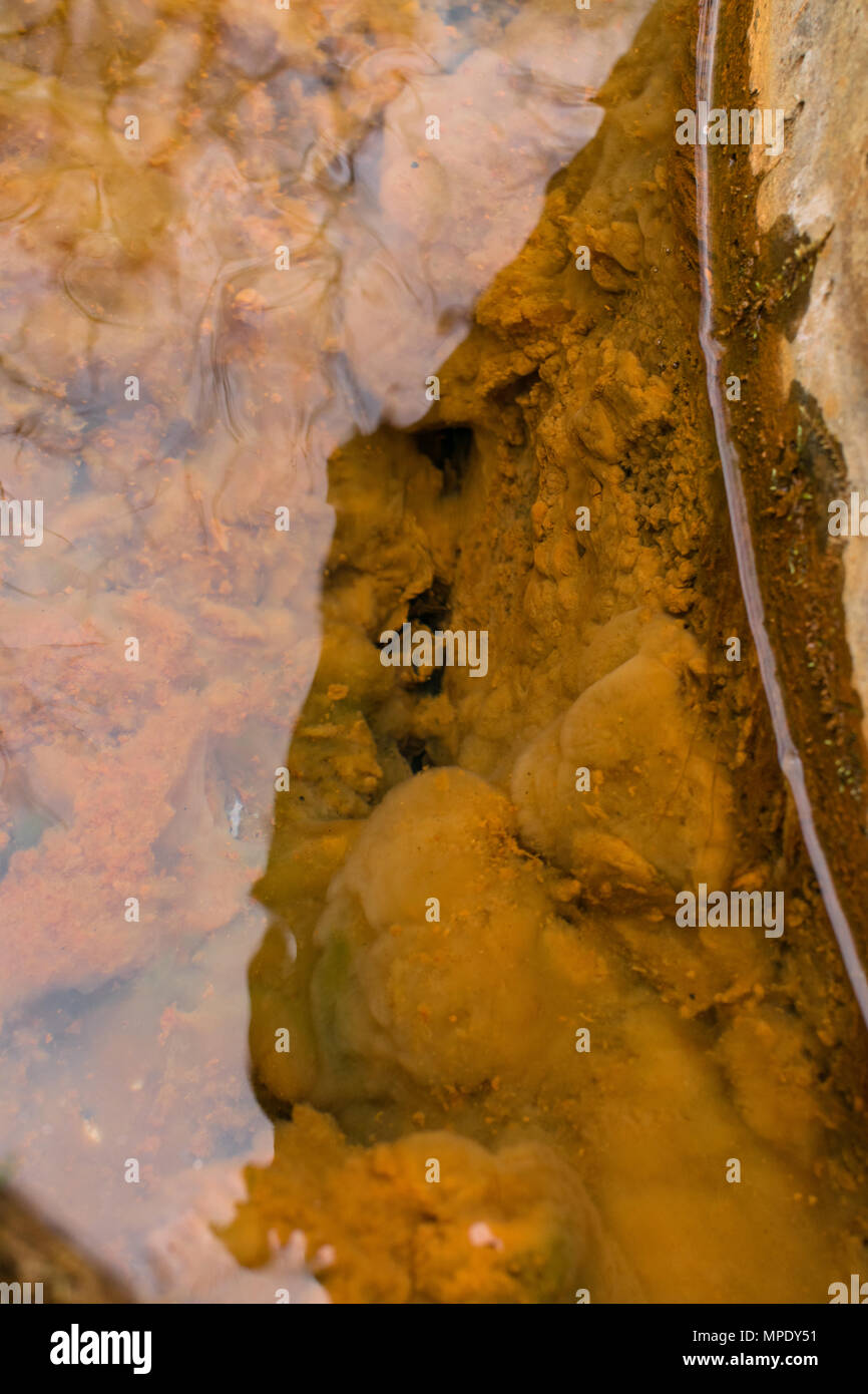 iron in spring water flowing. Metal in water Stock Photo Alamy