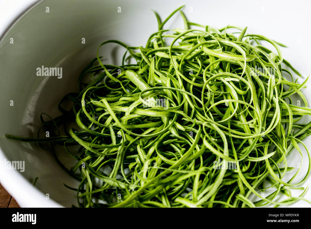 Green Peas Pod or Shell in a bowl. Organic Food. Stock Photo