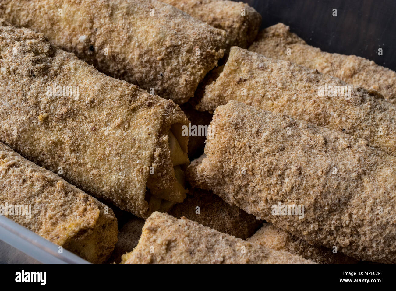 Raw Pastry with breadcrumbs / Chinese Egg Rolls before fyring Stock