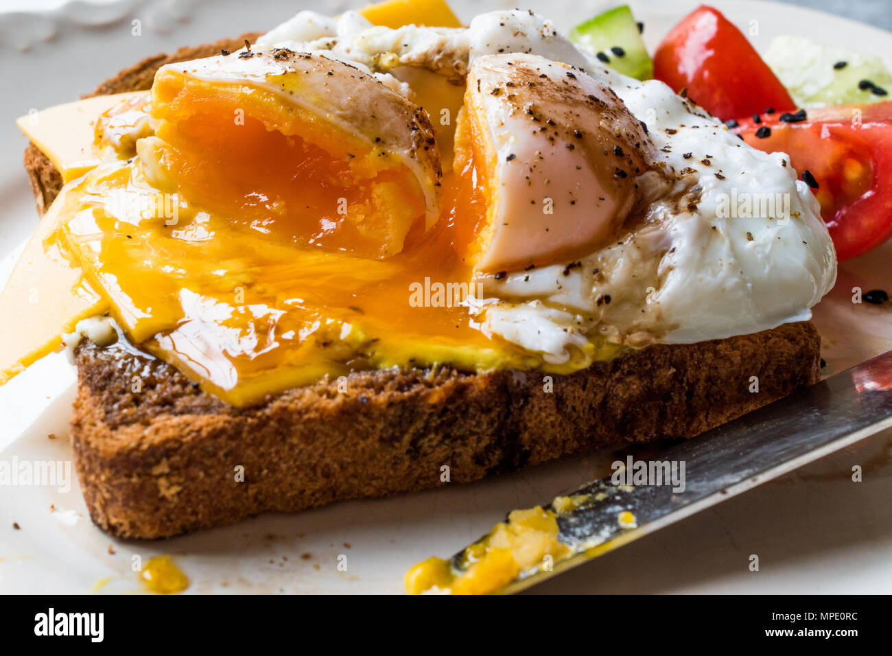 Poached Egg on Toast Bread with Cheddar Cheese, Balsamic Vinegar, Salad