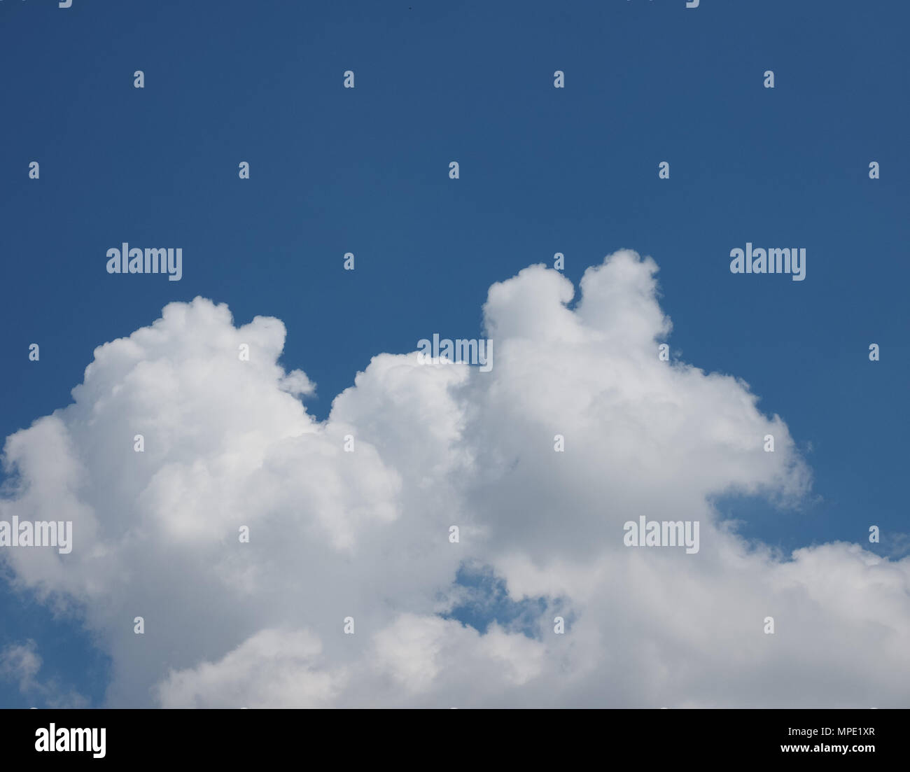 blue sky with clouds useful as a background Stock Photo - Alamy
