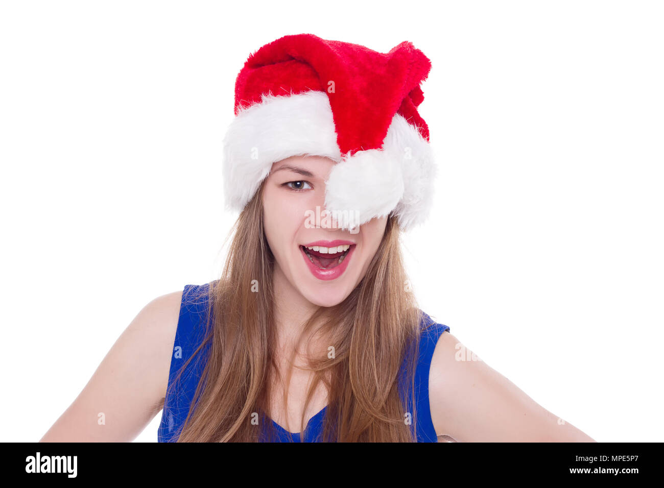 Portrait of joyful pretty woman in red santa claus hat laughing ...