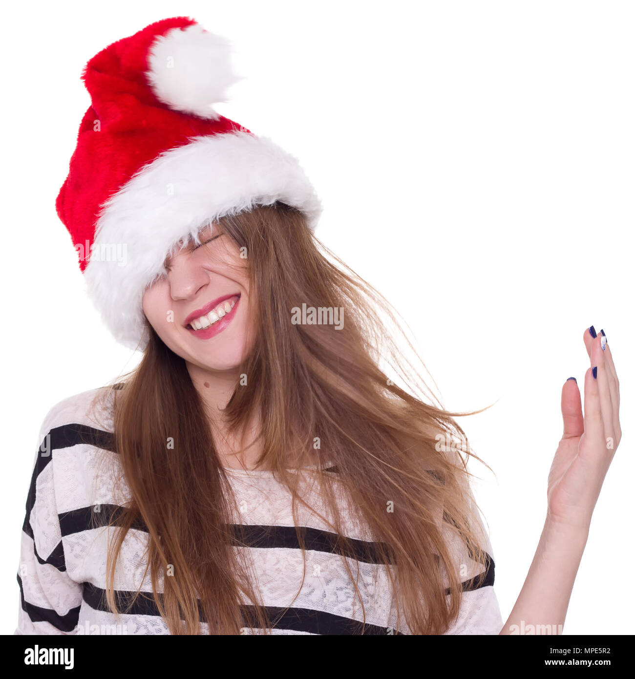 Expressive emotional girl in a Christmas hat on a white background. isolate Stock Photo