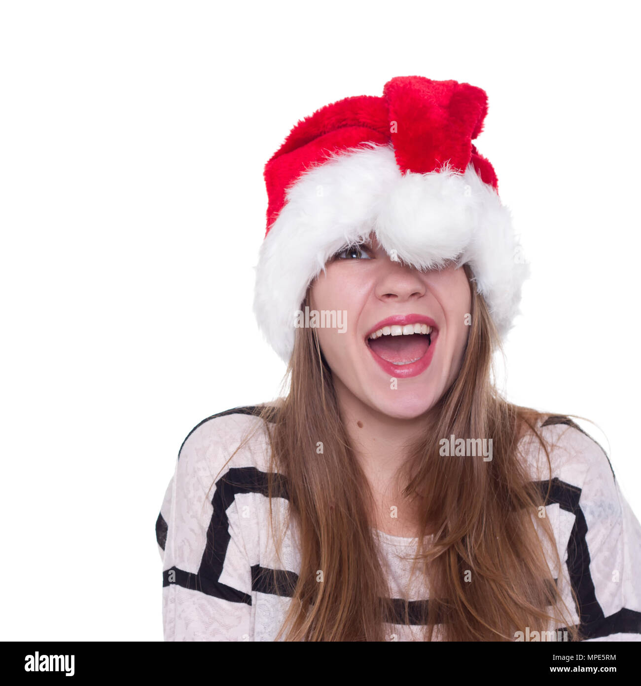 Portrait of joyful pretty woman in red santa claus hat laughing ...
