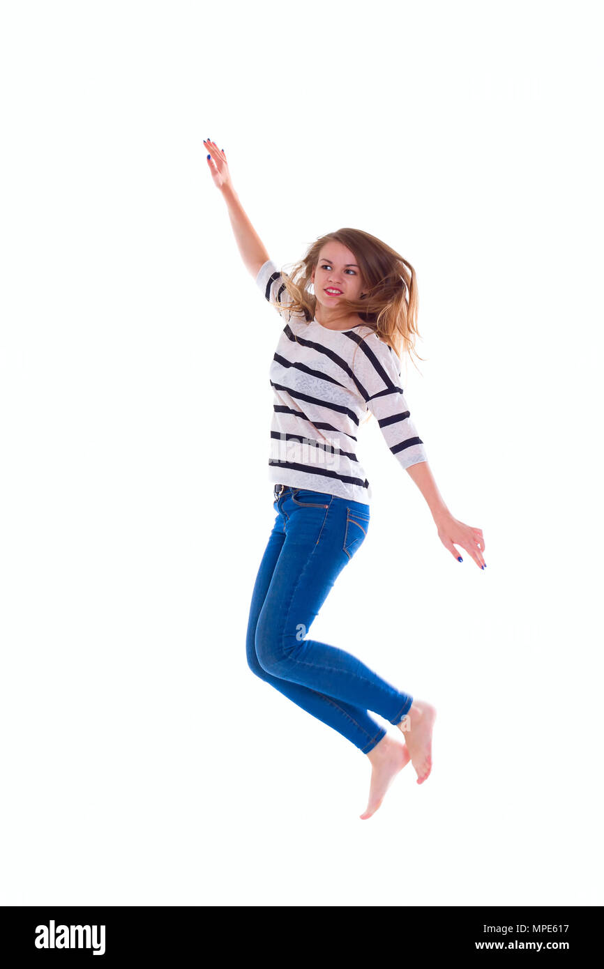 activity and happiness concept - smiling  girl in white blank t-shirt jumping Stock Photo