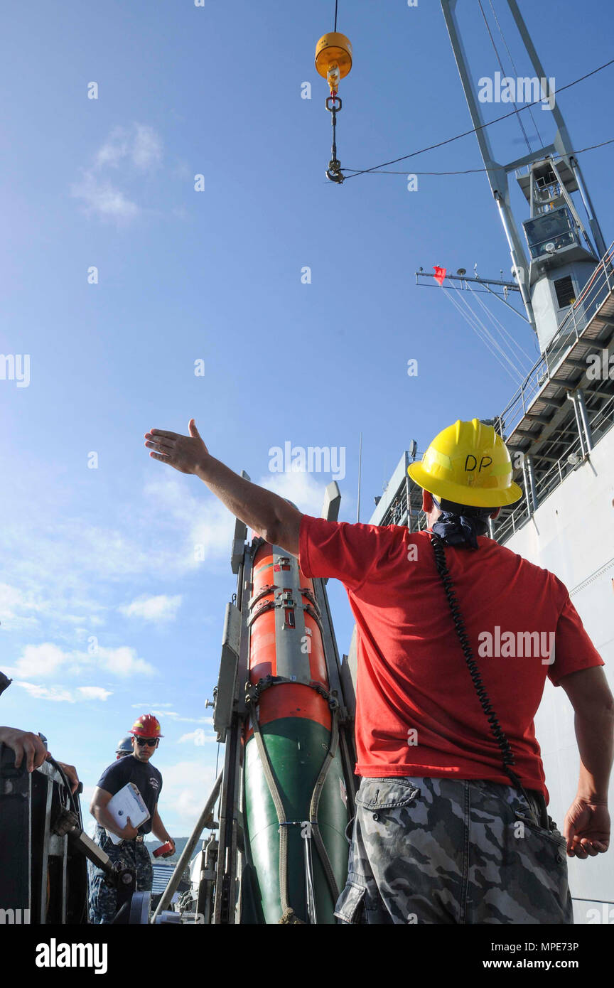 A crane signalman aboard Los Angeles-class attack submarine USS Chicago ...