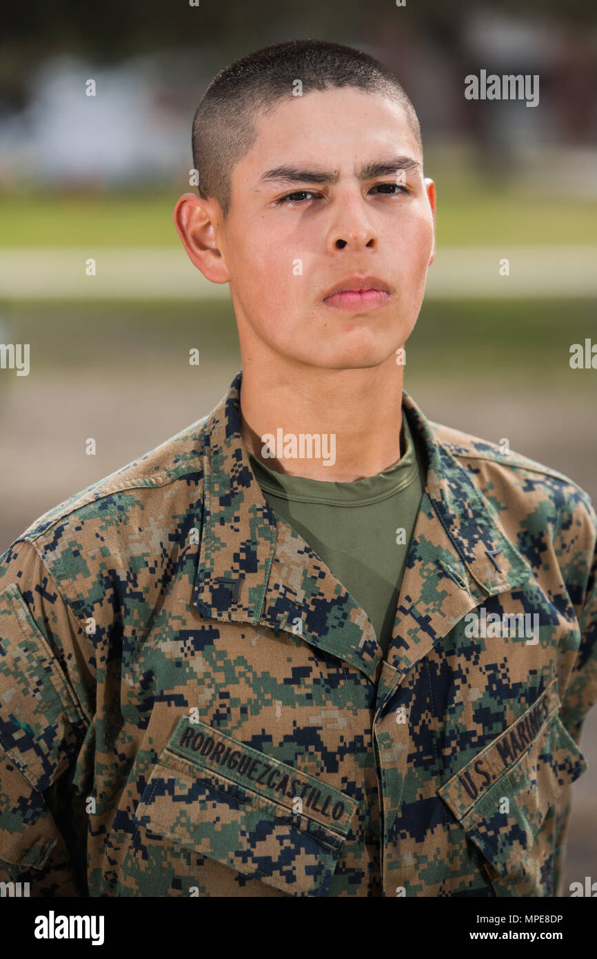 Pfc. Kevin E. Rodriguez Castillo, Platoon 2010, Golf Company, 2nd Recruit Training Battalion, earned U.S. citizenship Feb. 9, 2017, on Parris Island, S.C. Before earning citizenship, applicants must demonstrate knowledge of the English language and American government, show good moral character and take the Oath of Allegiance to the U.S. Constitution. Rodriguez Castillo, from Great Falls, Va., originally from El Salvador, is scheduled to graduate Feb. 10, 2017. (Photo by Lance Cpl. Maximiliano Bavastro) Stock Photo