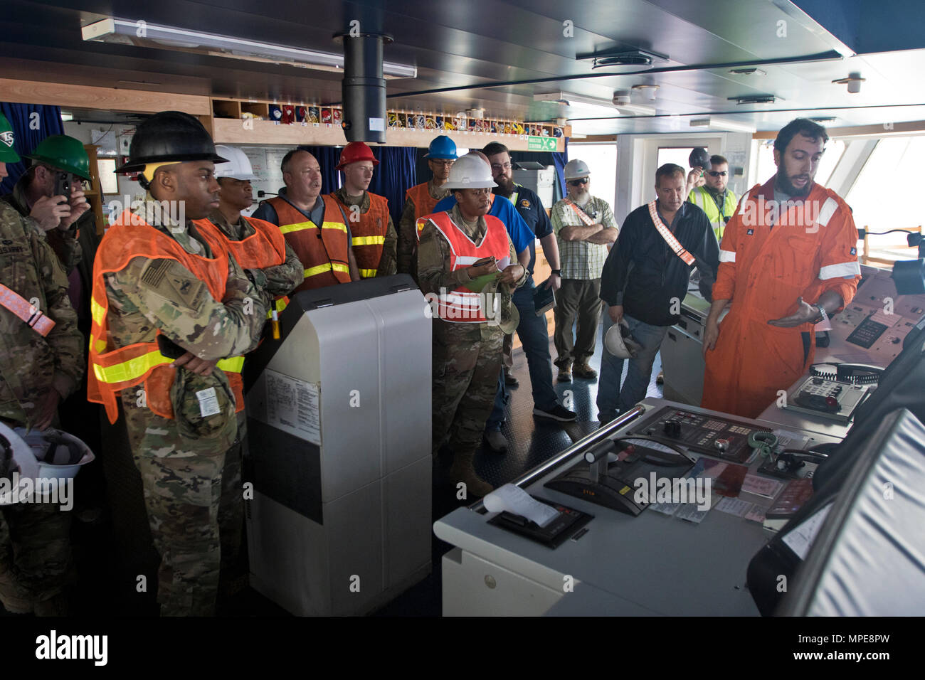 Adler Scott, 3rd Mate of the “Alliance Norfolk” vessel, (right), talks about safety procedures and vessel capabilities during the 2017 Worldwide Ammunition Logistics and Explosives Safety Review in Shuaiba Port, Kuwait, on Feb. 10, 2017. (U.S. Army Photo by Staff Sgt. Dalton Smith) Stock Photo