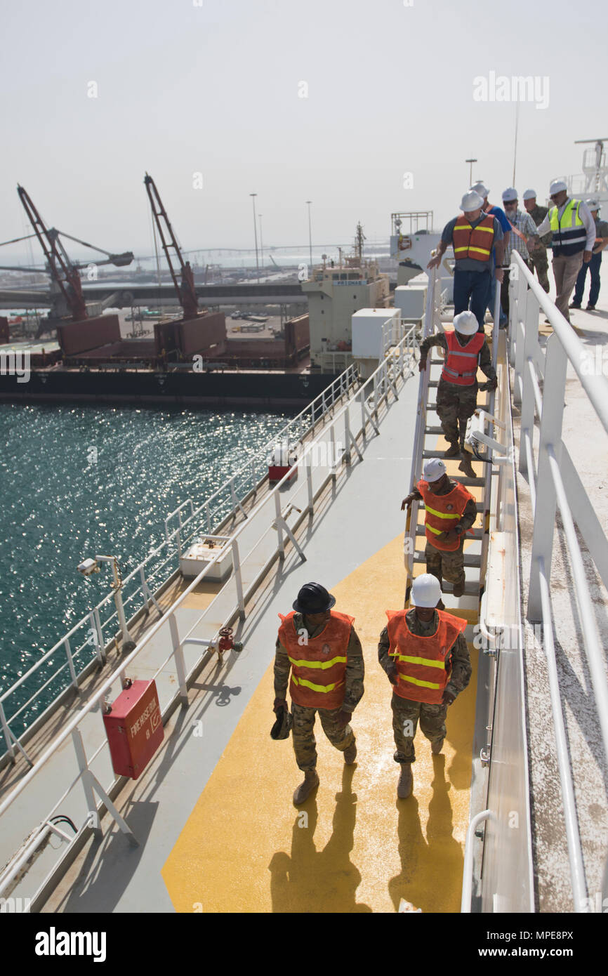 1st Sustainment Command (Theater) Soldiers and members of the U.S. Army Defense Ammunition Center review team review the safety procedures of vessel operations during the 2017 Worldwide Ammunition Logistics and Explosives Safety Review in Shuaiba Port, Kuwait, on Feb. 10, 2017. (U.S. Army Photo by Staff Sgt. Dalton Smith) Stock Photo
