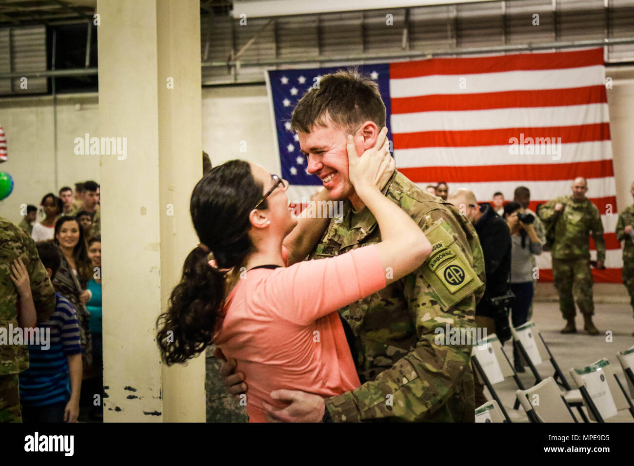 A Soldier with the 82nd Combat Aviation Brigade Pathfinder Company, reunites with his loved one