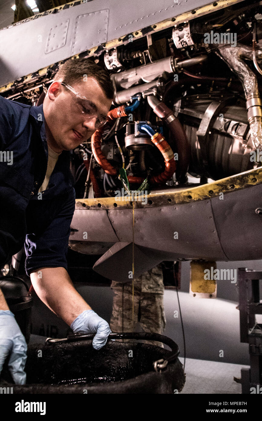 Staff Sgt. Anthony Balsley from the 179th Airlift Wing, Mansfield, Ohio changes filters on an engine of a C-130H Hercules during an isochronal inspection Feb. 10, 2017.  The 179th Airlift Wing is always on a mission to be the first choice to respond to community, state and federal missions with a trusted team of highly qualified Airmen. (U.S. Air National Guard photo by 1st Lt. Paul StennettReleased) Stock Photo