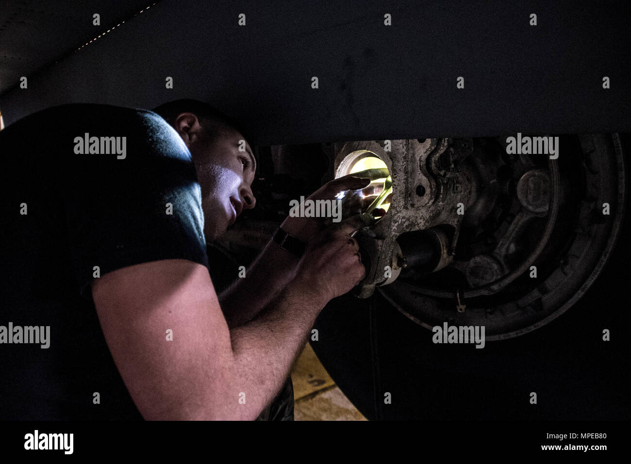 Tech. Sgt. Anthony Boscia from the 179th Airlift Wing, Mansfield, Ohio works on the anti-skid system to a C-130H Hercules during an isochronal inspection Feb. 10, 2017.  The 179th Airlift Wing is always on a mission to be the first choice to respond to community, state and federal missions with a trusted team of highly qualified Airmen. (U.S. Air National Guard photo by 1st Lt. Paul StennettReleased) Stock Photo