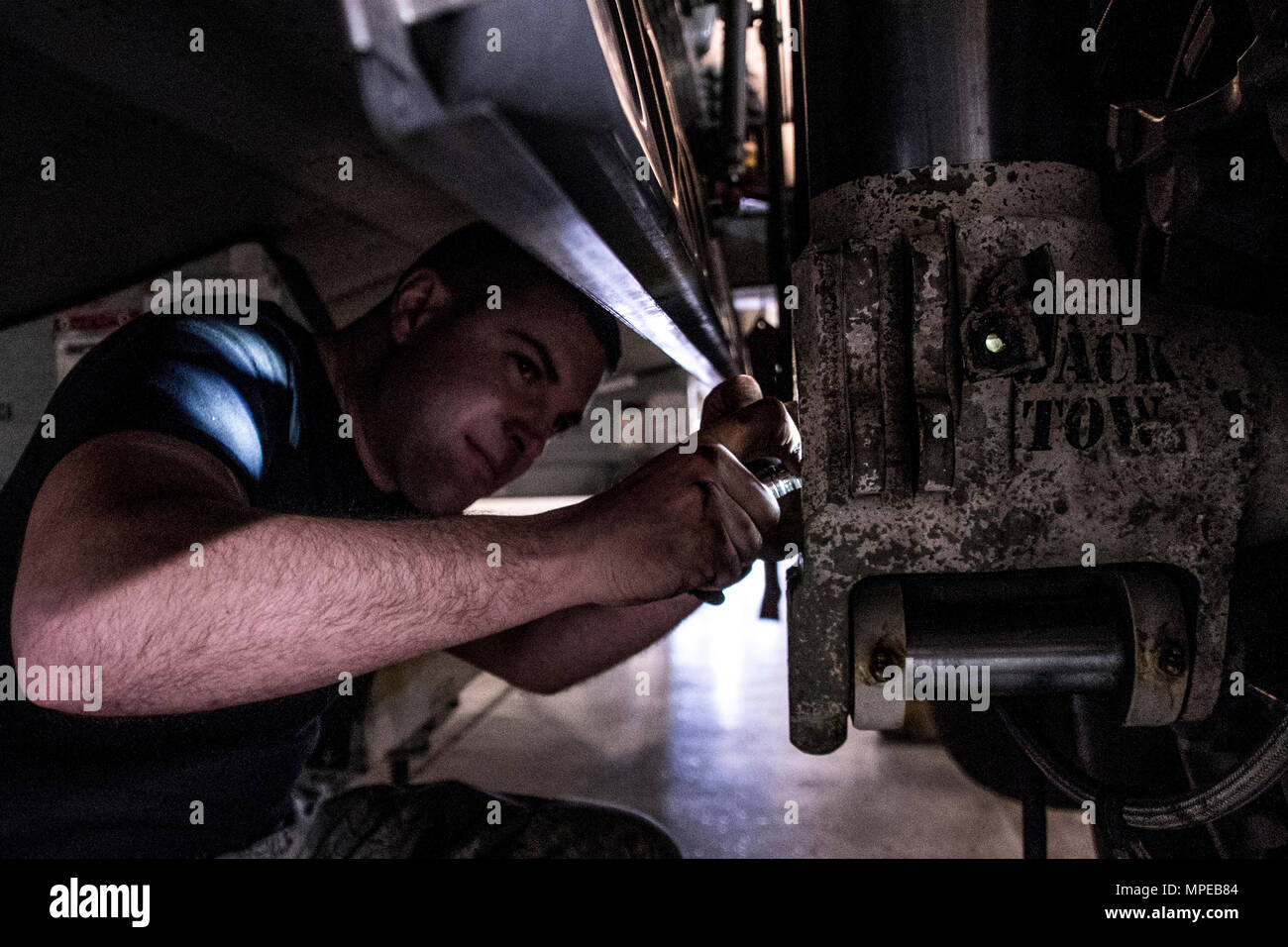 Tech. Sgt. Anthony Boscia from the 179th Airlift Wing, Mansfield, Ohio works on the anti-skid system to a C-130H Hercules during an isochronal inspection Feb. 10, 2017.  The 179th Airlift Wing is always on a mission to be the first choice to respond to community, state and federal missions with a trusted team of highly qualified Airmen. (U.S. Air National Guard photo by 1st Lt. Paul StennettReleased) Stock Photo