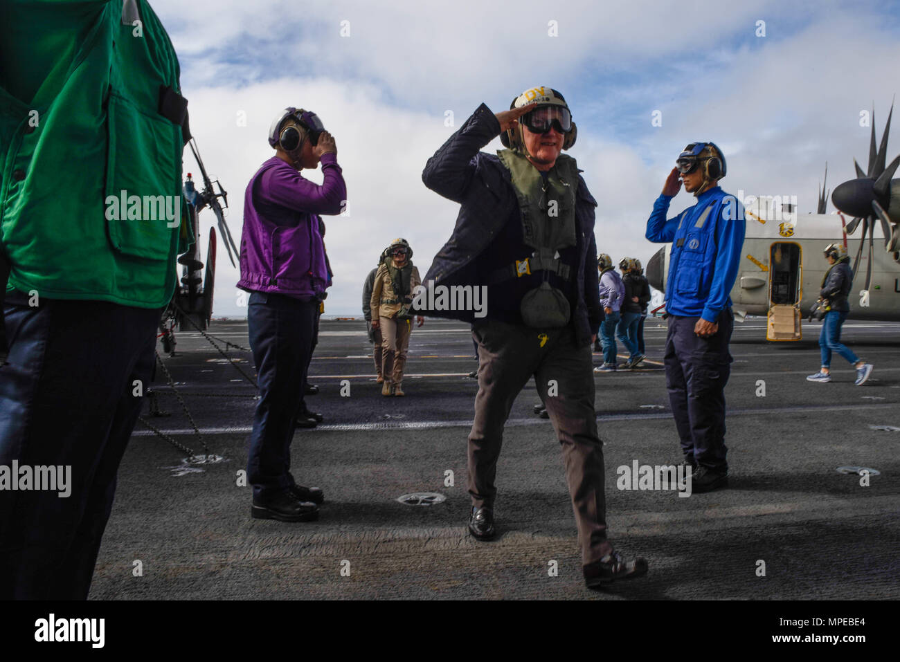 170210-N-VN584-055 PACIFIC OCEAN (Feb. 10, 2017) Side boys salute former Secretary of the Navy John Lehman as he is piped aboard the aircraft carrier USS Theodore Roosevelt (CVN 71). Theodore Roosevelt is currently off the coast of Southern California conducting routine training operations. (U.S. Navy Photo by Mass Communication Specialist Seaman Alex Corona/Released) Stock Photo