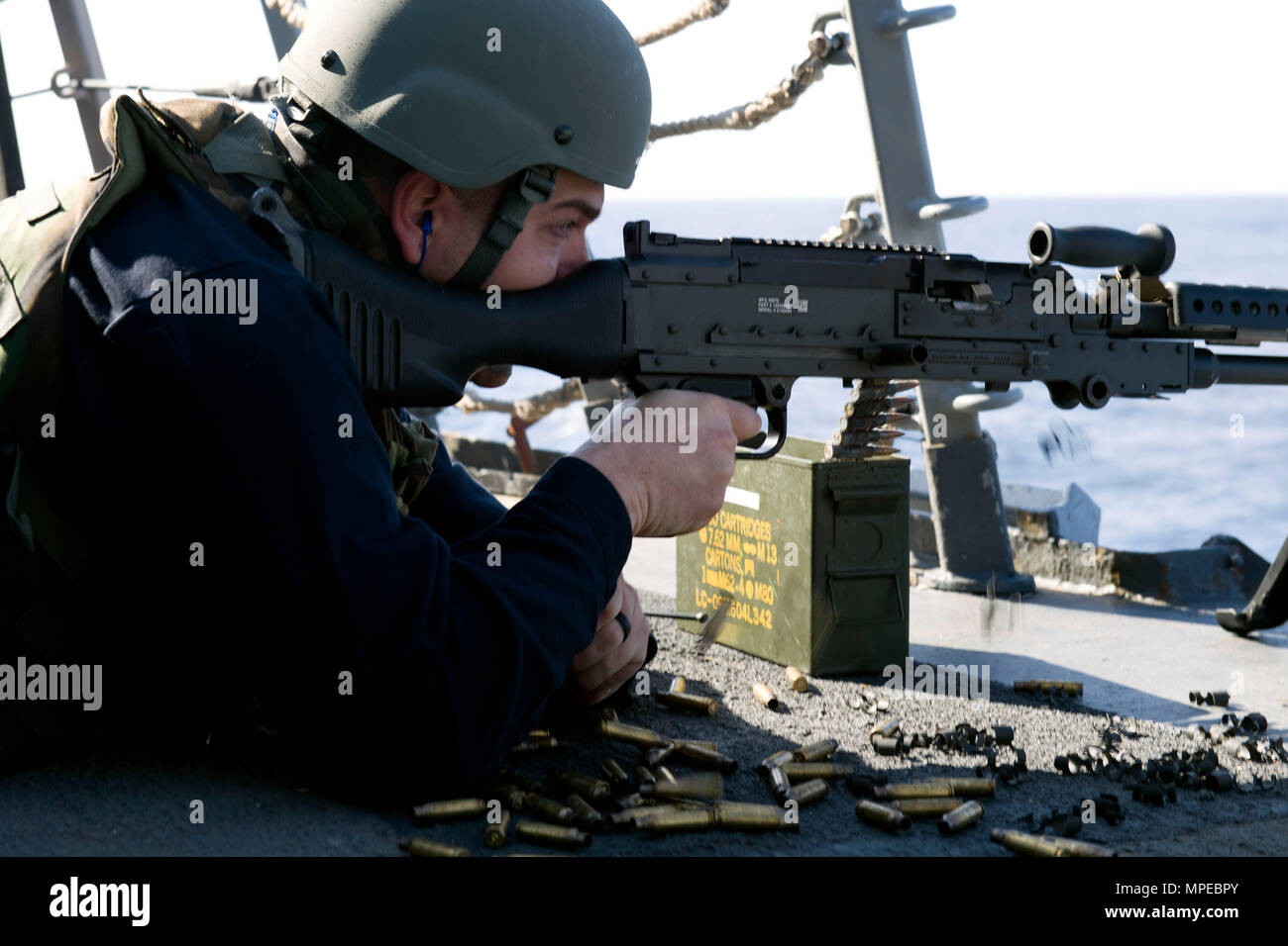 170208-N-NB178-143 MEDITERRANEAN SEA (Feb. 8, 2017) Logistics Specialist 2nd Class Stephen Lowe fires a .50-caliber machine gun during a live-fire exercise aboard the guided-missile destroyer USS Truxtun (DDG 103). Truxtun, part of the George H.W. Bush Strike Group, is conducting naval operations in the U.S. 6th Fleet area of operations in support of U.S. national security interests in Europe. (U.S. Navy photo by Mass Communication Specialist 2nd Class Tyrell K. Morris/Released) Stock Photo