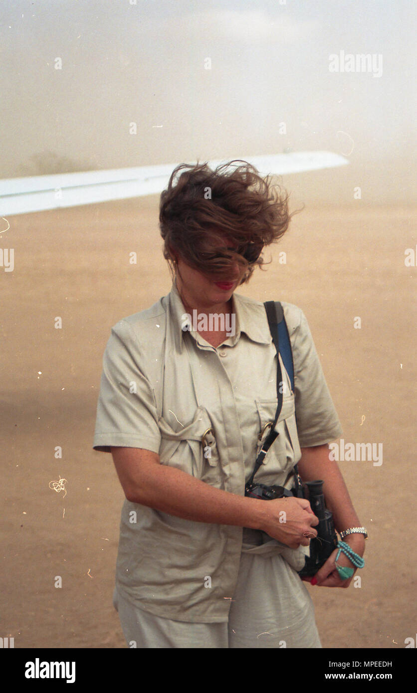 WOMAN HOLDING CAMERA Stock Photo - Alamy