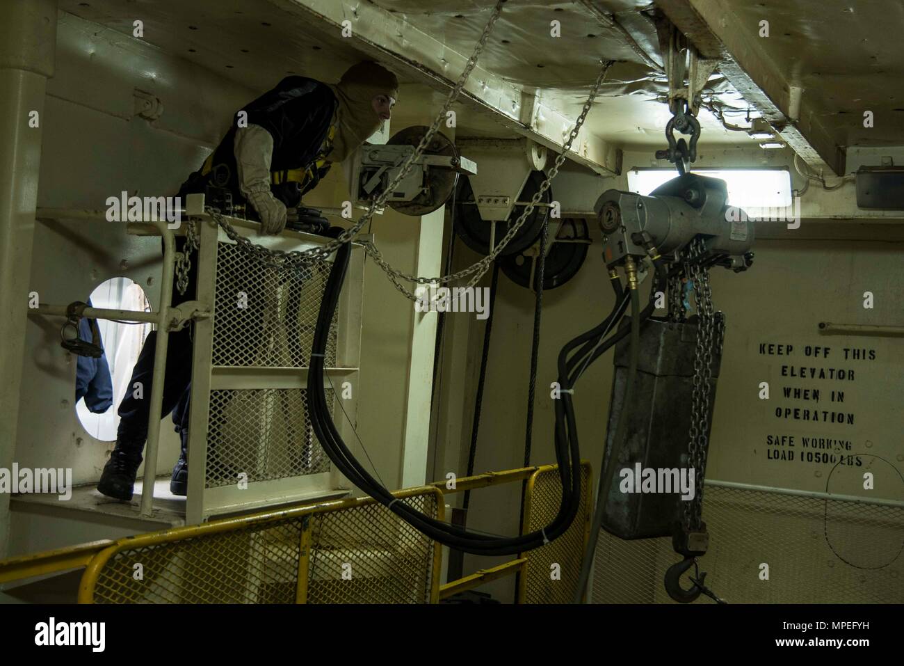 170214-N-QI061-141  ATLANTIC OCEAN (Feb. 14, 2017) Aviation Ordnanceman Airman Jeremy Voyles, from Kingston, Okla., maneuvers a 2-ton pneumatic hoist in a weapons elevator aboard the aircraft carrier USS Dwight D. Eisenhower (CVN 69) (Ike) during a general quarters drill. Ike is currently conducting aircraft carrier qualifications during the sustainment phase of the Optimized Fleet Response Plan (OFRP). (U.S. Navy photo by Mass Communication Specialist 3rd Class Nathan T. Beard) Stock Photo