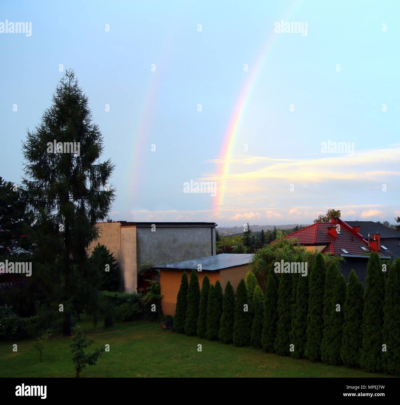 rare double rainbow above the city after a heavy summer storm Stock ...